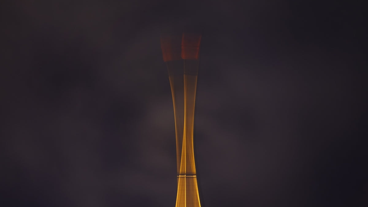 gold and red stick with black background