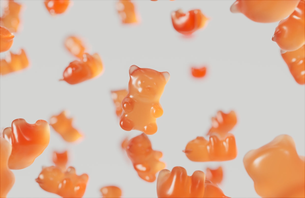 a group of gummy bears floating in the air