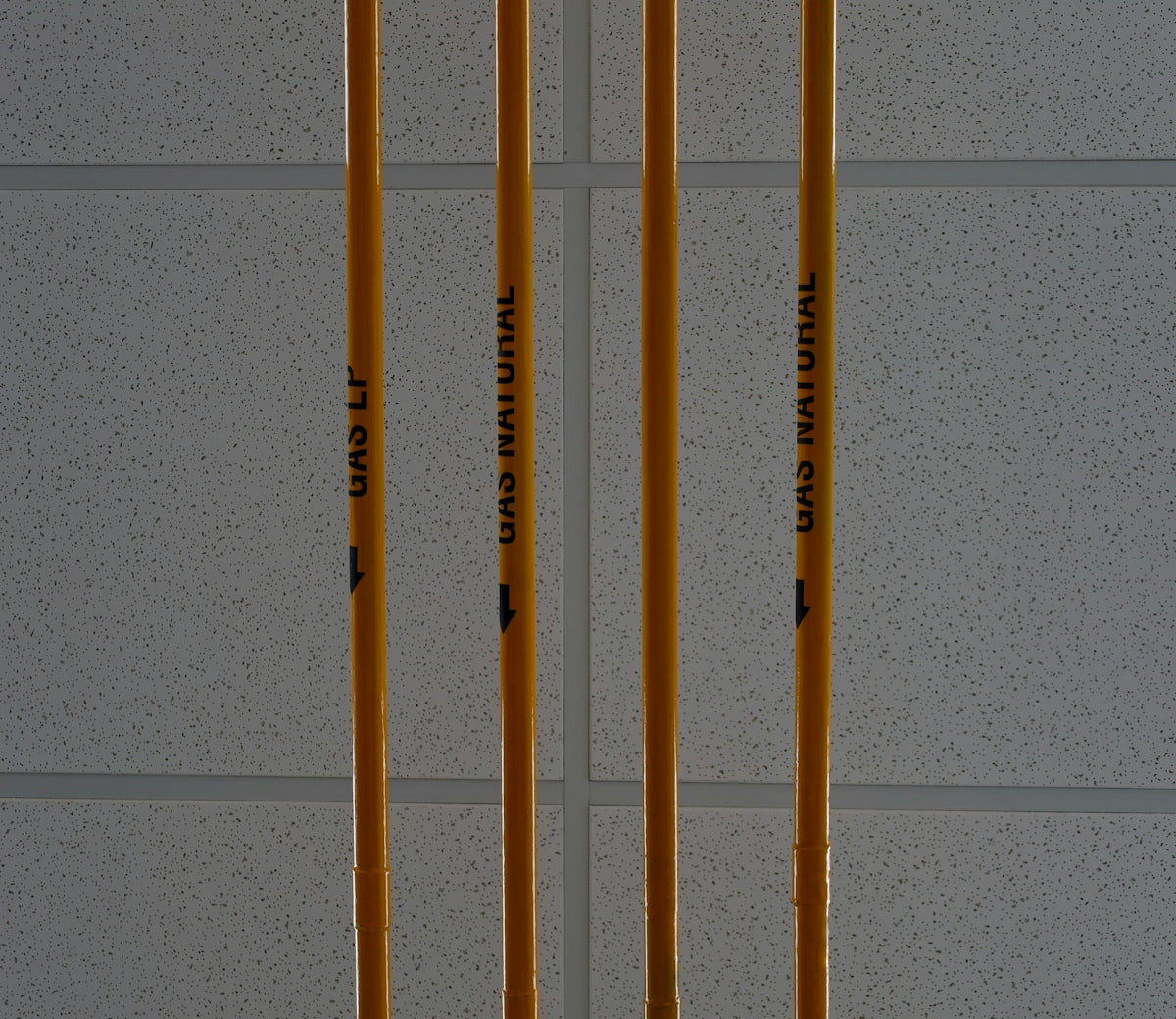 a couple of yellow poles sitting next to each other