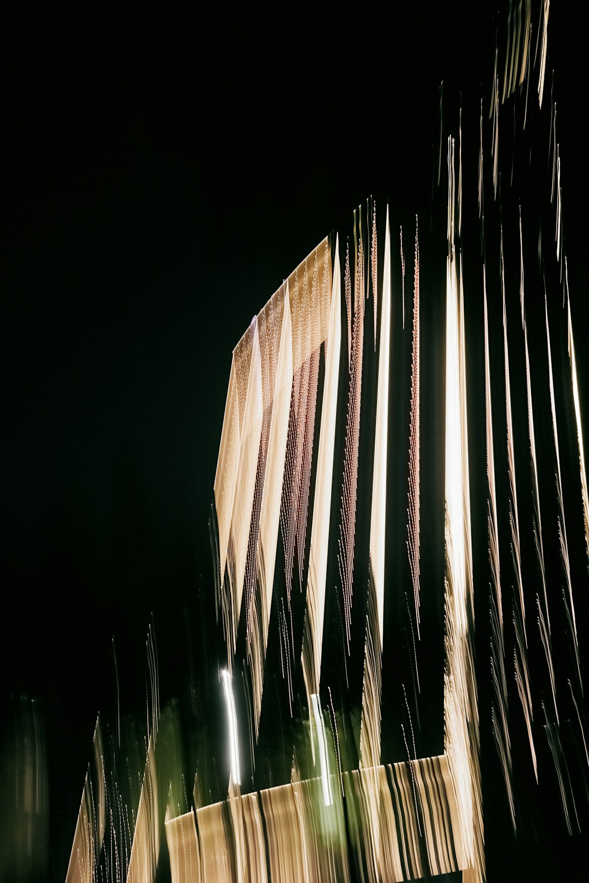 Abstract light streaks against a dark background