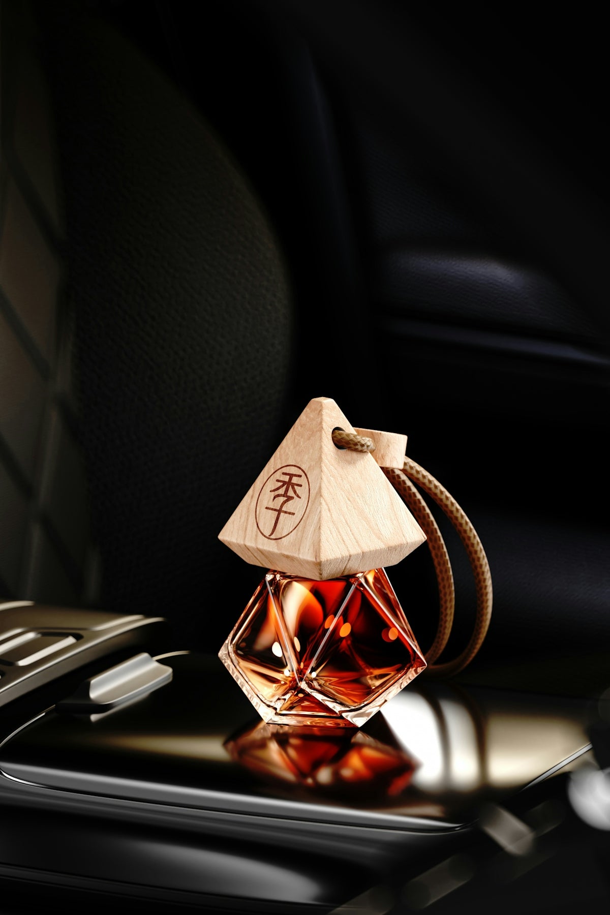 A pyramid-shaped car air freshener with liquid inside