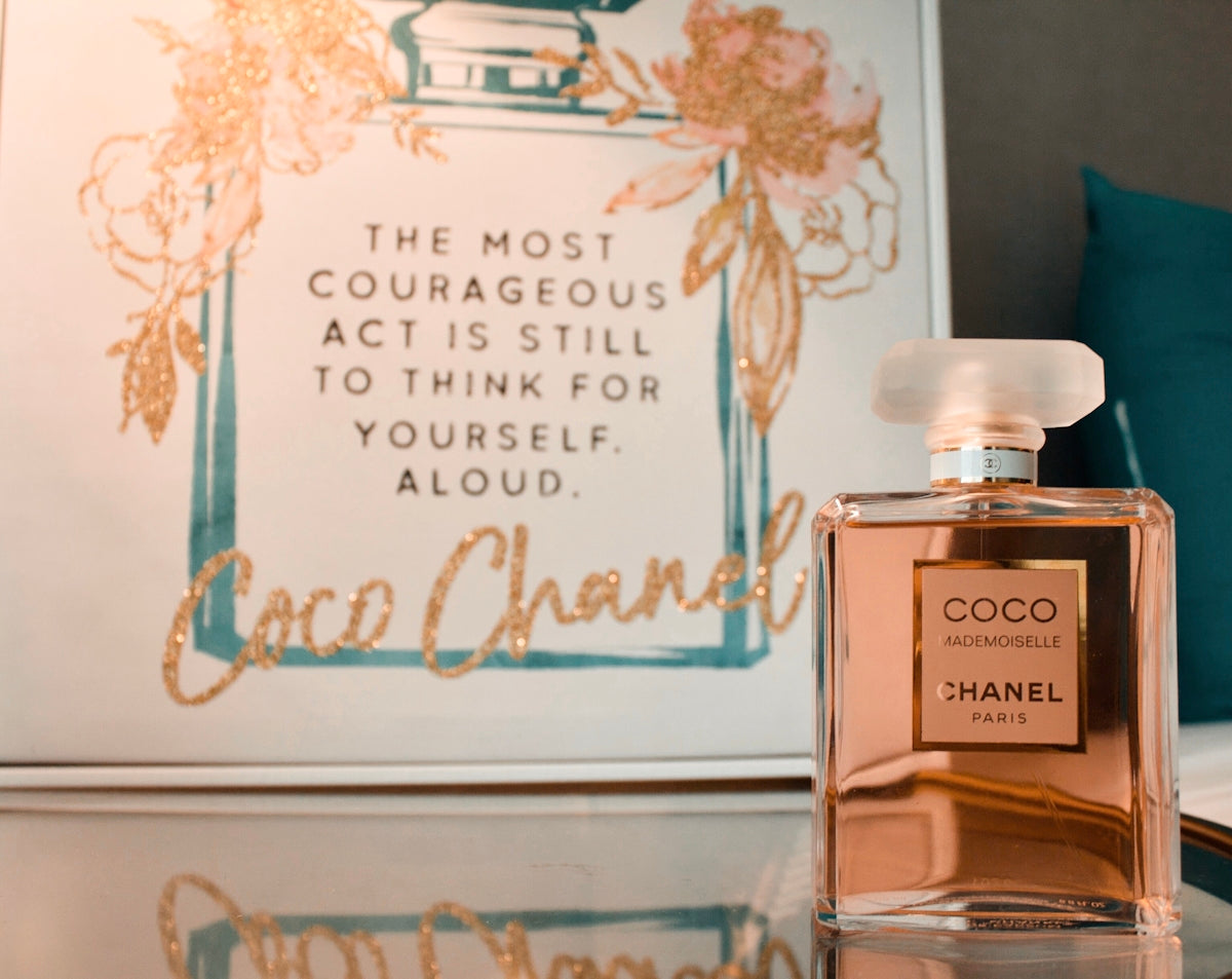 Chanel Coco Paris fragrance bottle on clear surface