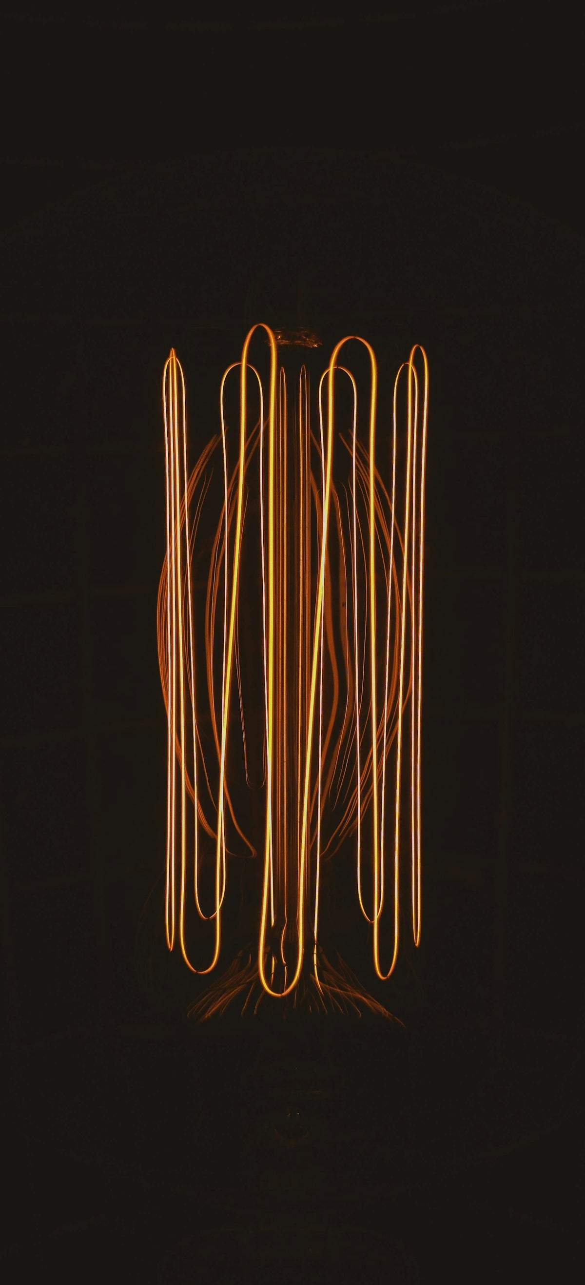 a black background with a bunch of orange lights