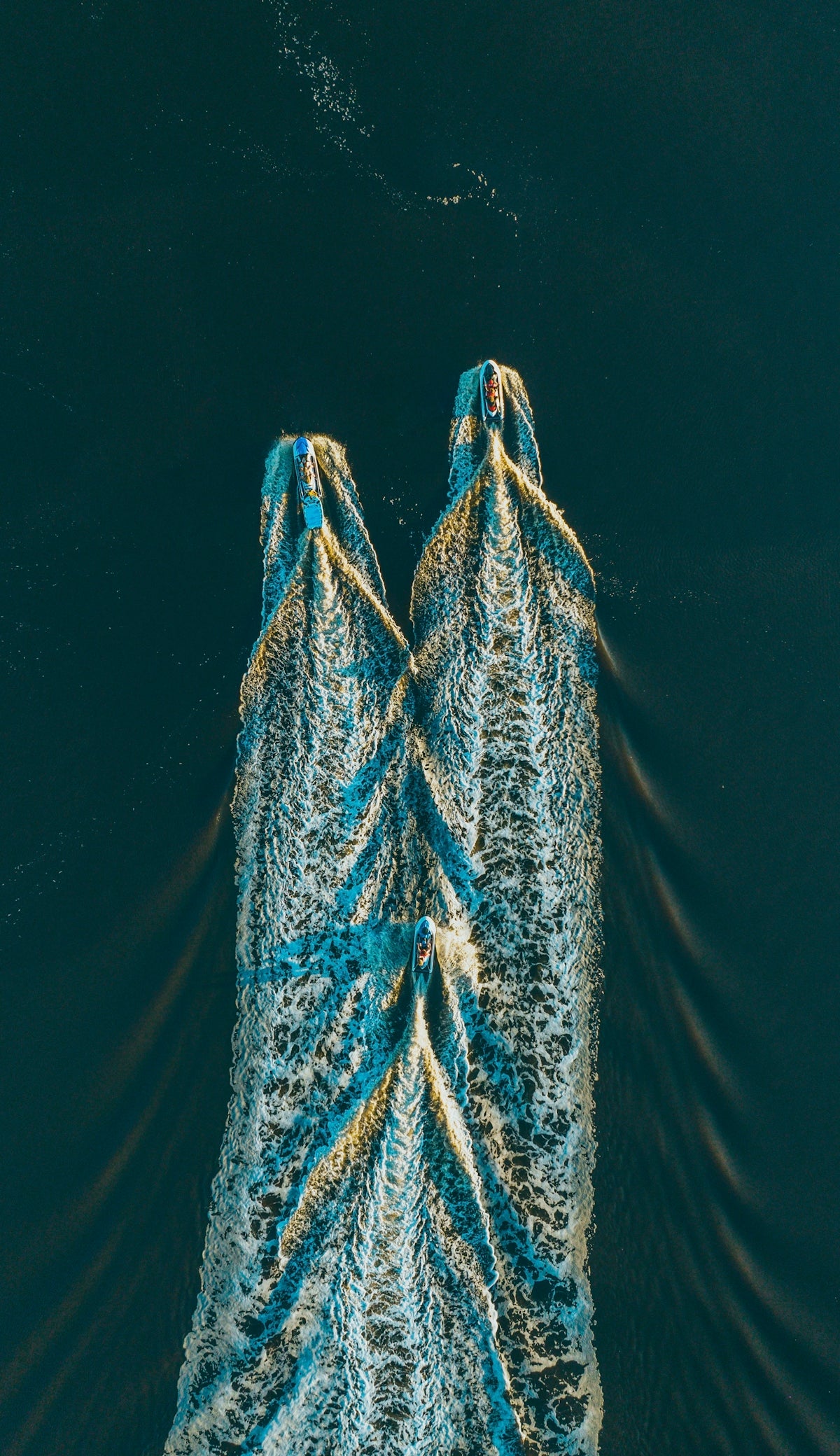 two boats are seen from above in the water