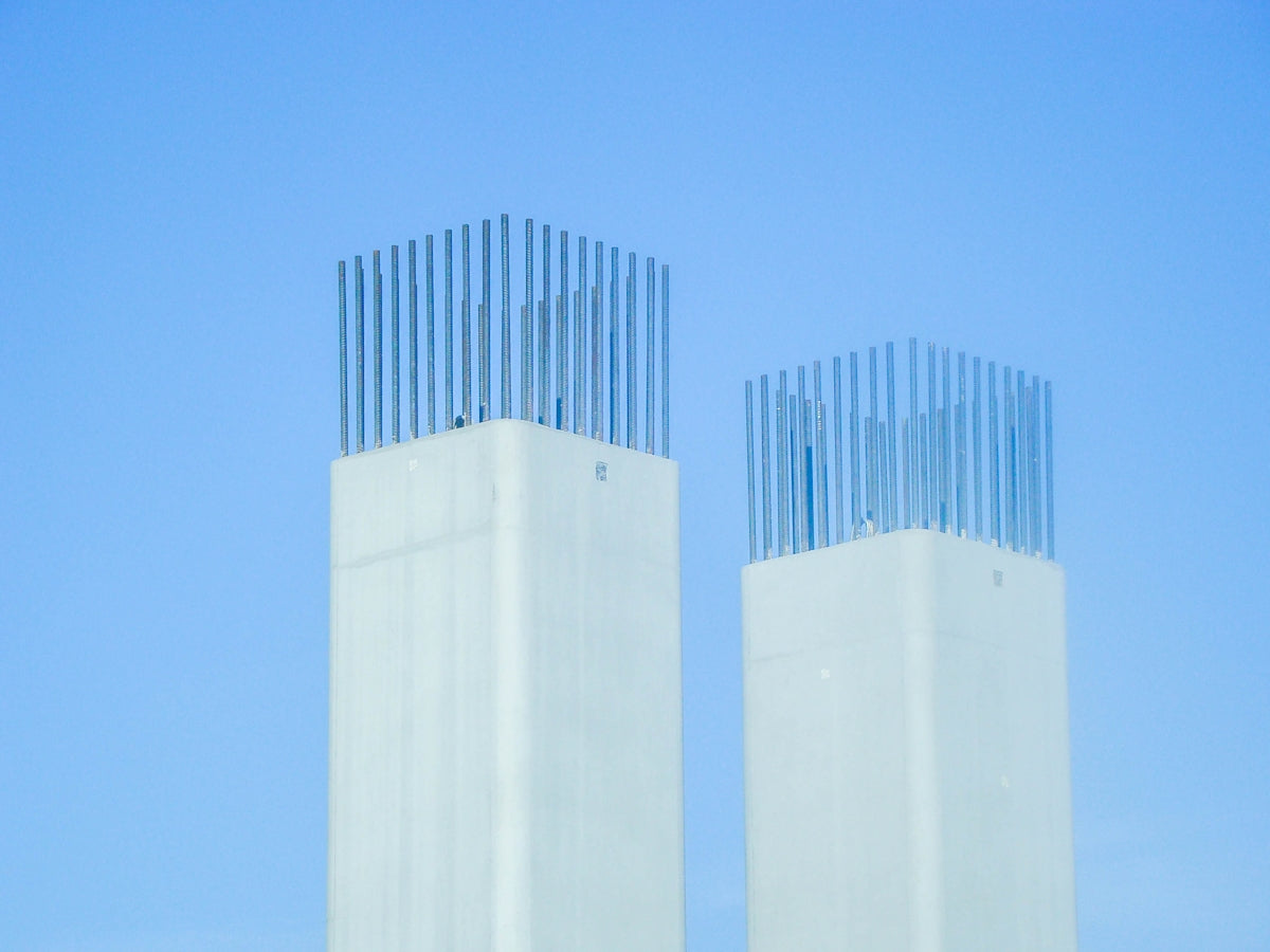 a couple of tall white towers sitting next to each other