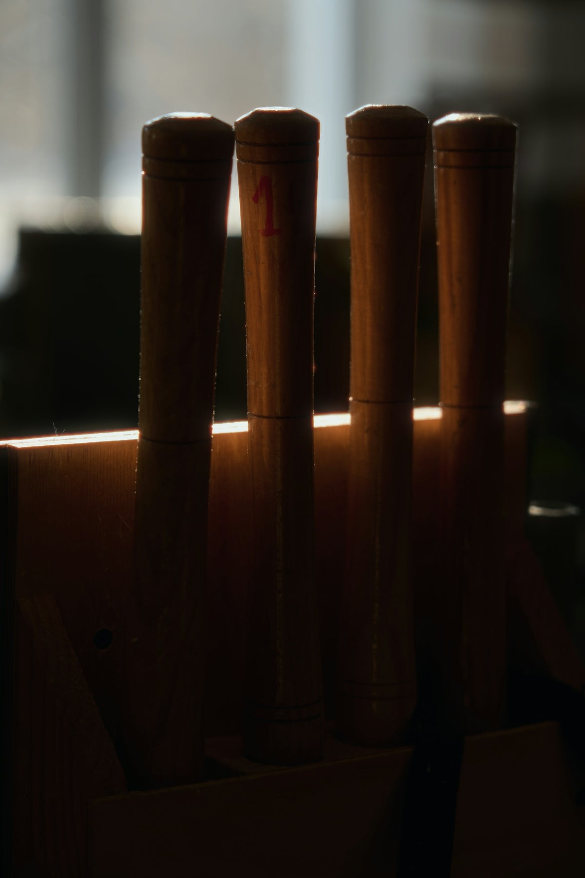 A close up of a row of baseball bats