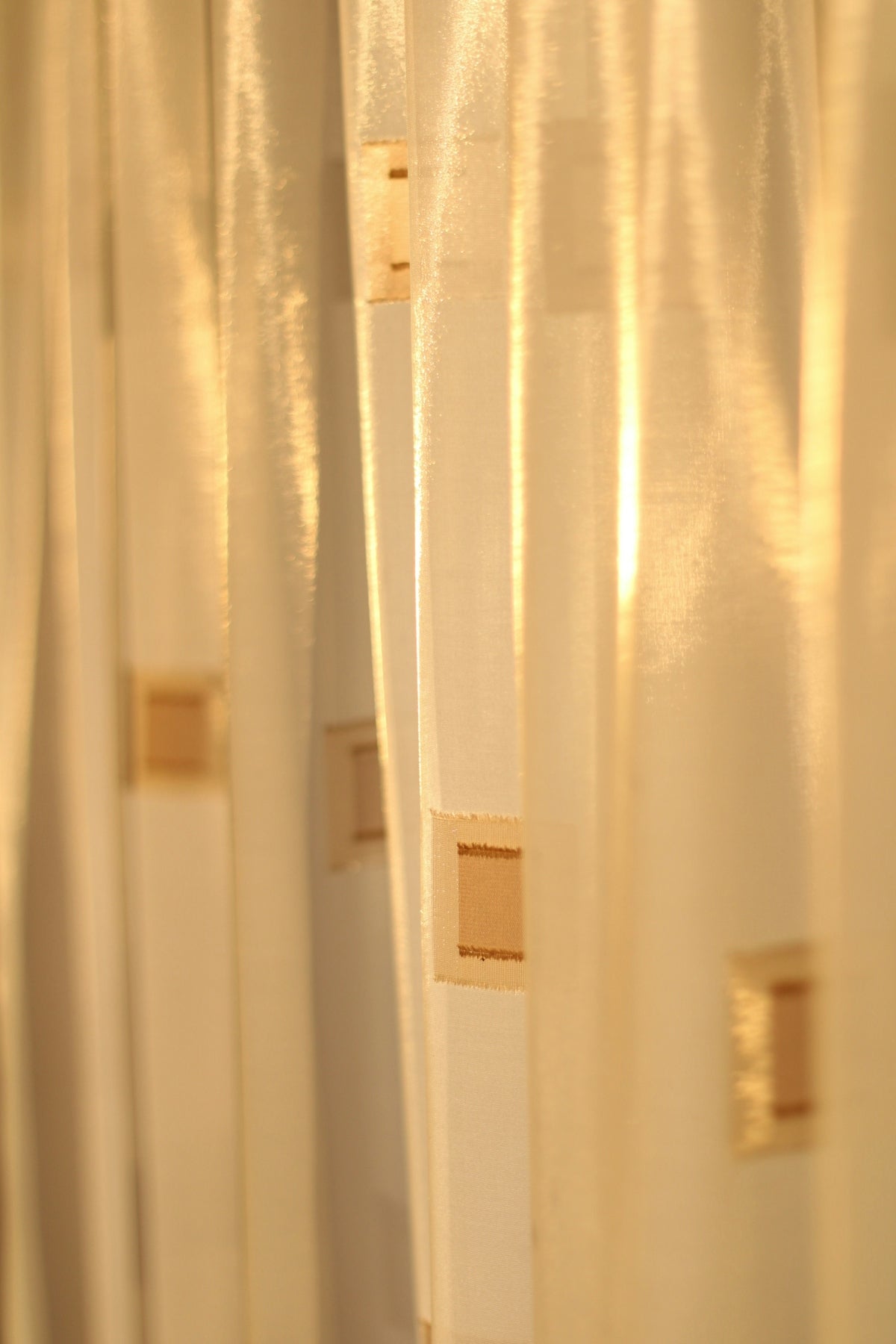 A bathroom with a toilet and a shower curtain