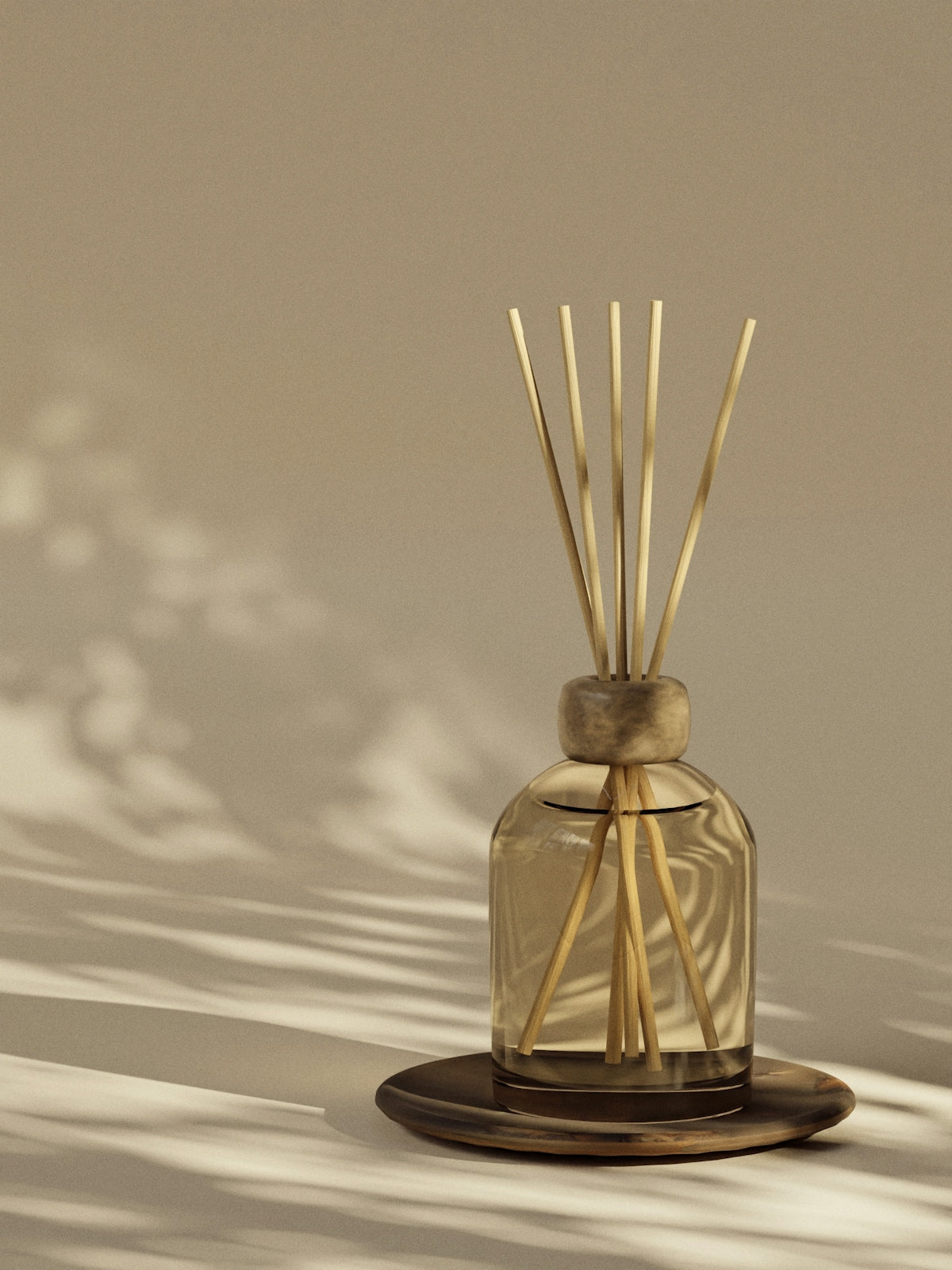 Reed diffuser sits on a wooden tray.