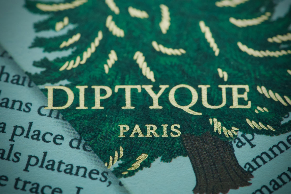 Diptyque paris logo on a green tree pattern