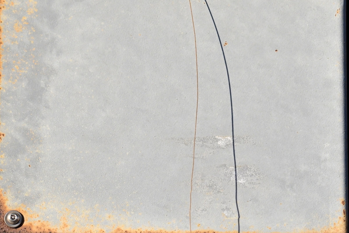 Close-up of rusty metal with a crack